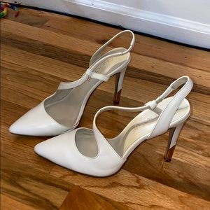White strappy stilettos with gold heal